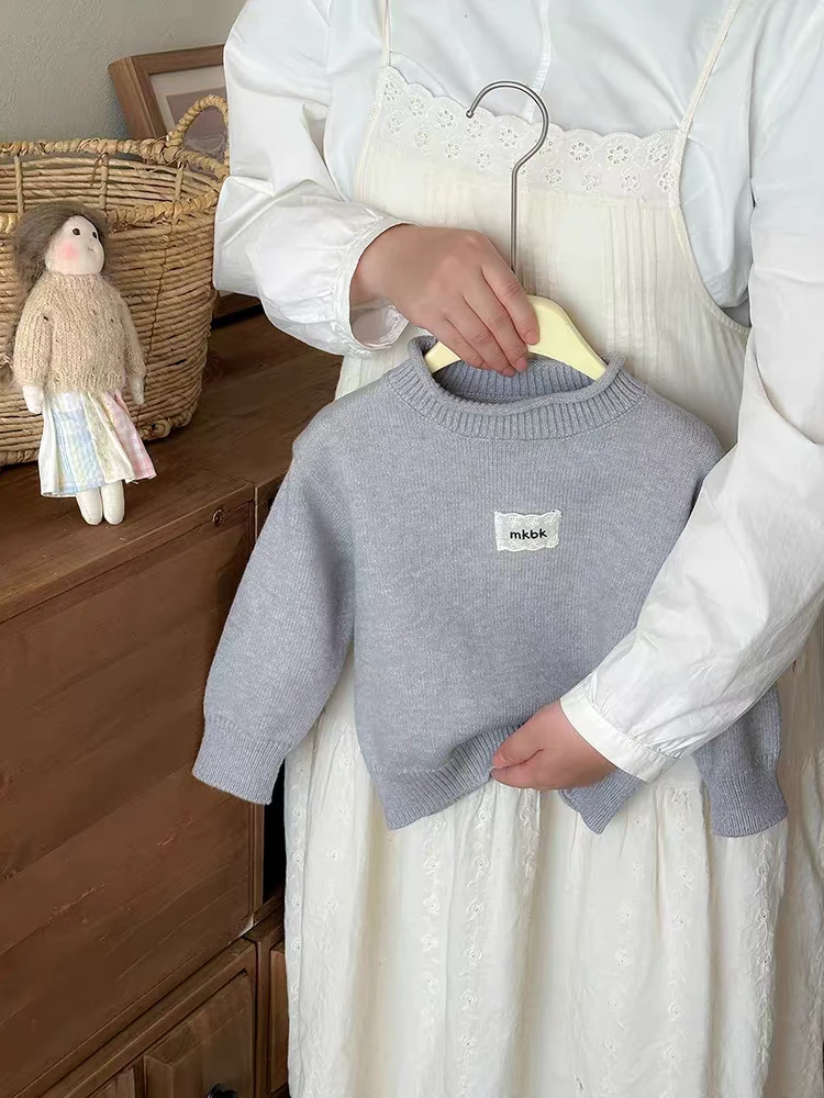 儿童毛衣秋冬新款上衣纯色贴标圆领男童女童针织衫