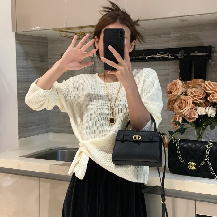 韩系设计感下摆提扣针织衫秋冬新款百搭简约休闲纯色气质女装毛衣