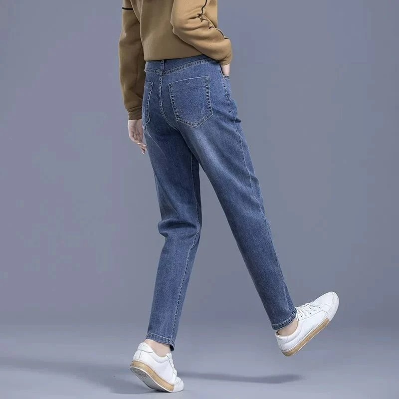 蓝色哈伦牛仔裤女秋季新款爆款高腰显瘦老爹裤弹力小脚九分女裤子
