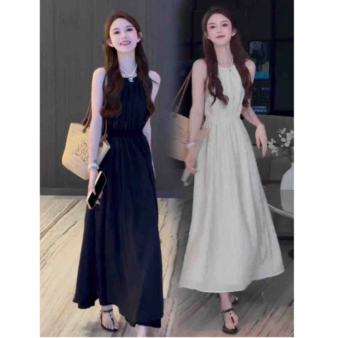 夏季仙仙气质小心机宽松盐系时尚露背长裙赫本风清新吊带连衣裙女