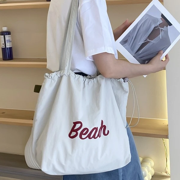 新2025通勤尼龙托特包加内衬beach学生抽绳单肩包大容量印花字母