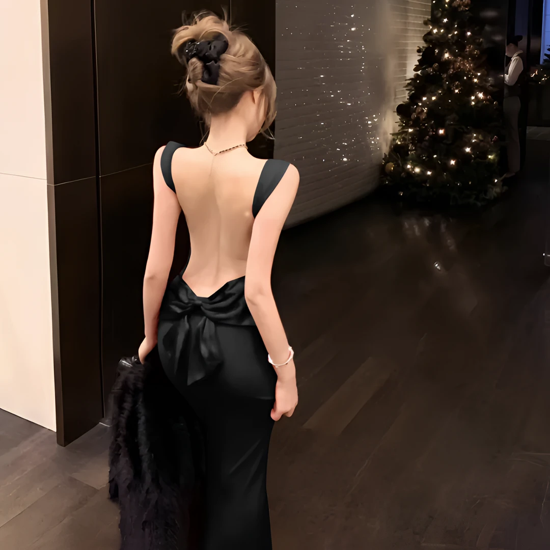 欧美露背蝴蝶结包臀连衣裙夏季纯欲辣妹性感时尚气质修身黑色长裙
