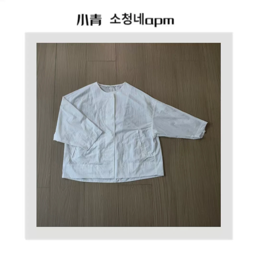 韩国东大门 薄纹斜口袋纽扣外套