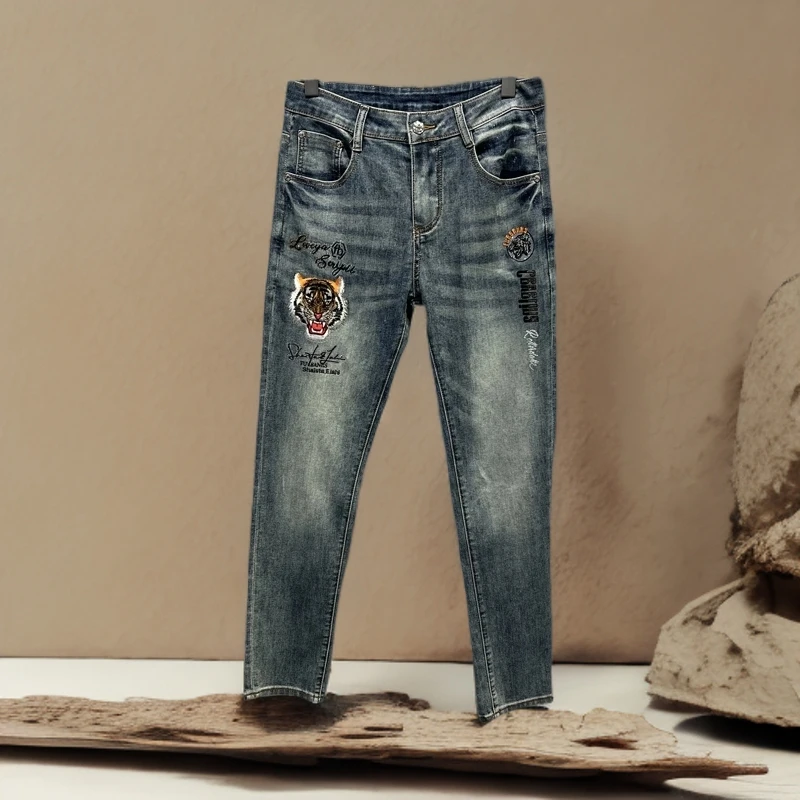 诺顿雷斯欧货潮牌个性虎头烫钻刺绣修身男夏季薄款帅气脚裤牛仔裤