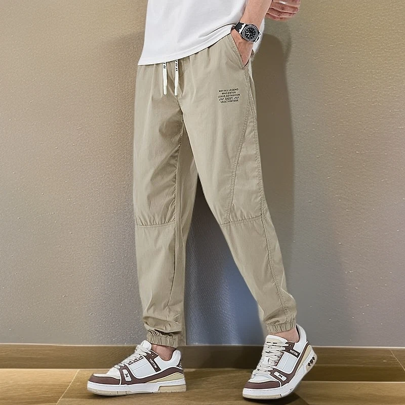 2025夏季薄款束脚休闲裤男网红爆款潮牌字母冰丝速干运动裤九分裤