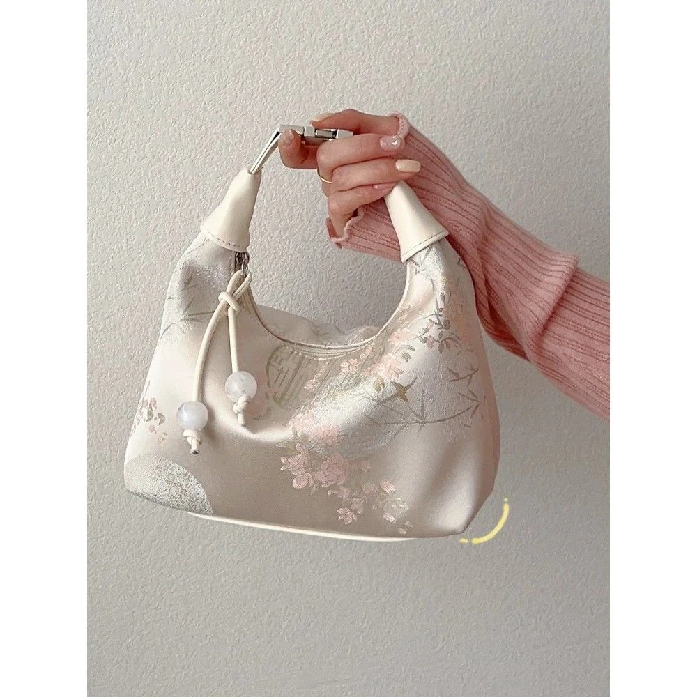 手拎国风刺绣旗袍包包女2025新款夏季斜挎饺子包古风新中式手提包