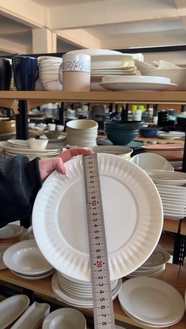 新骨瓷018瑕疵暖白 太阳花 9寸平盘