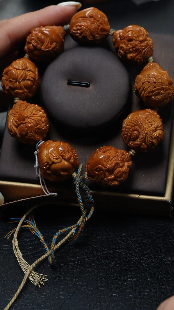 橄榄核手串旅****1鱼子精品核雕