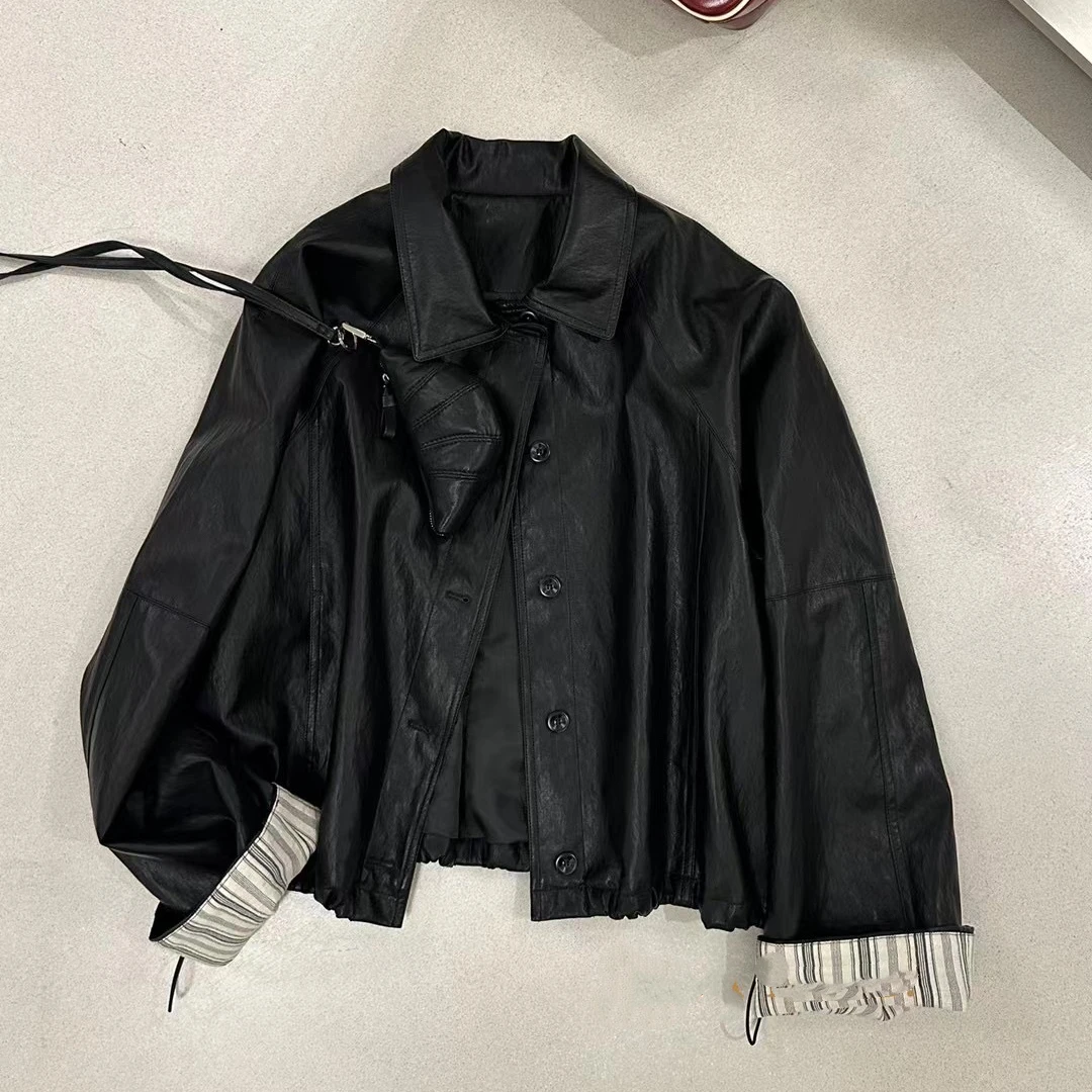 仓美美女装-撞色翻领带包款设计皮衣