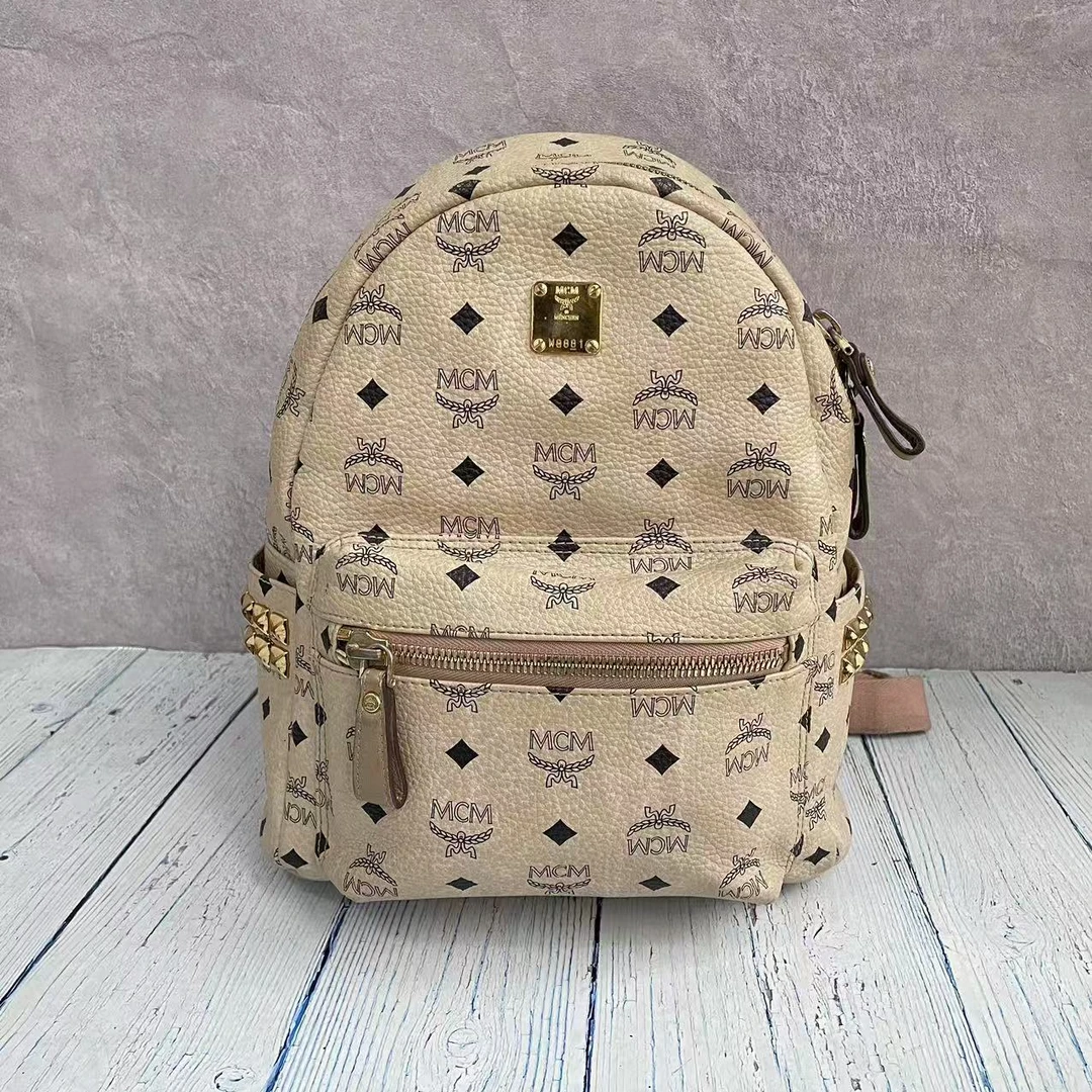 95新 MCM mcm米色小号双肩包