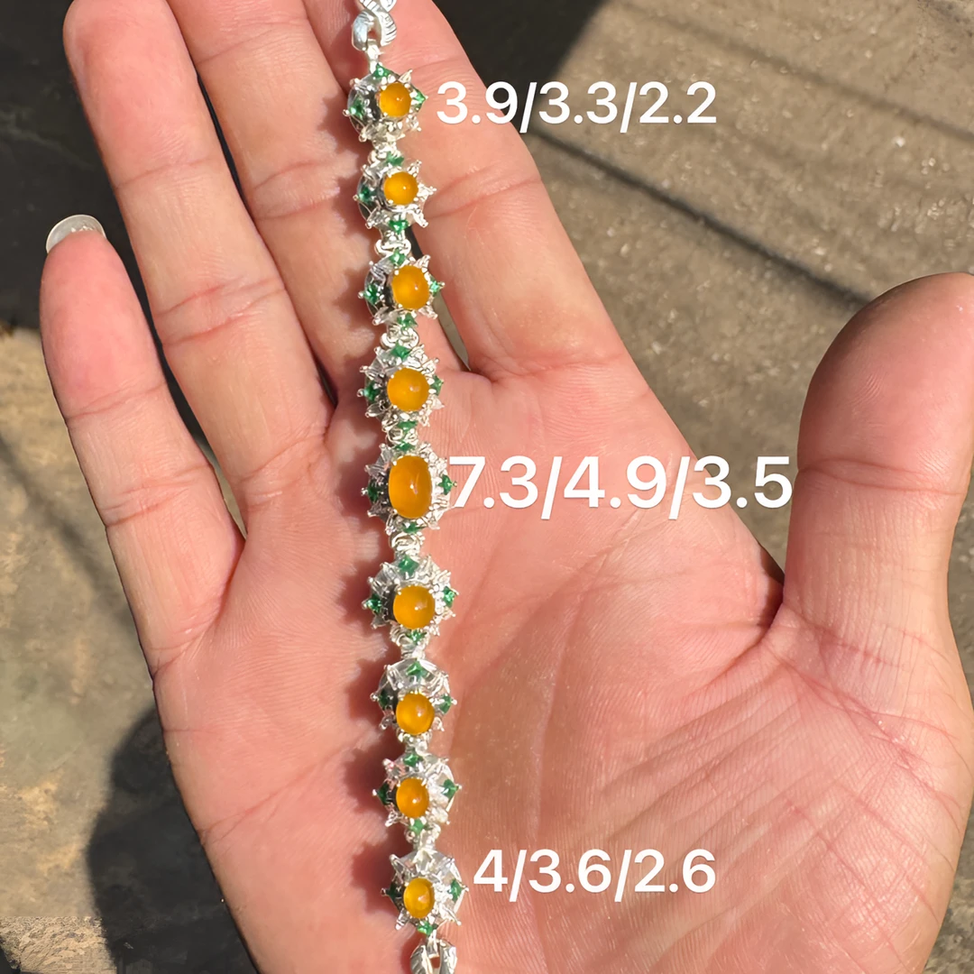 0206(小哪吒在源头)冰种翡翠黄翡戒面共9颗干净肉细杠味荧光足M60