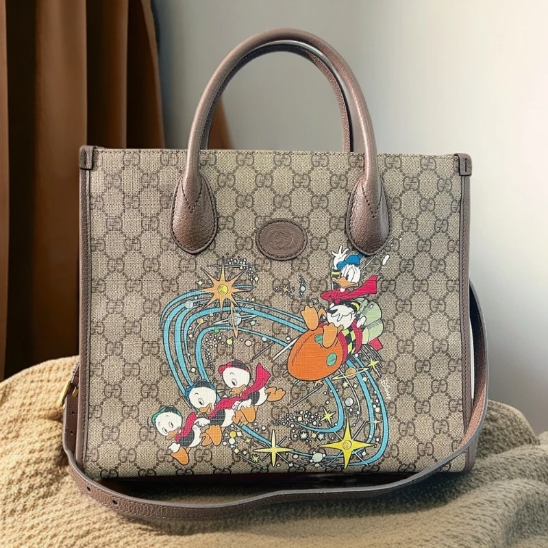 95新 GUCCI/古驰  老花唐老鸭手提单肩包 1724 4660