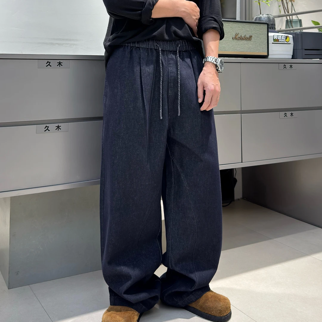 蓝色牛仔裤男秋季时尚青年潮流设计感宽松休闲直筒松紧腰弯刀裤子