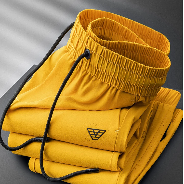 高级感夏季透气穿孔运动裤男收口小脚薄款冰丝速干休闲卫裤男