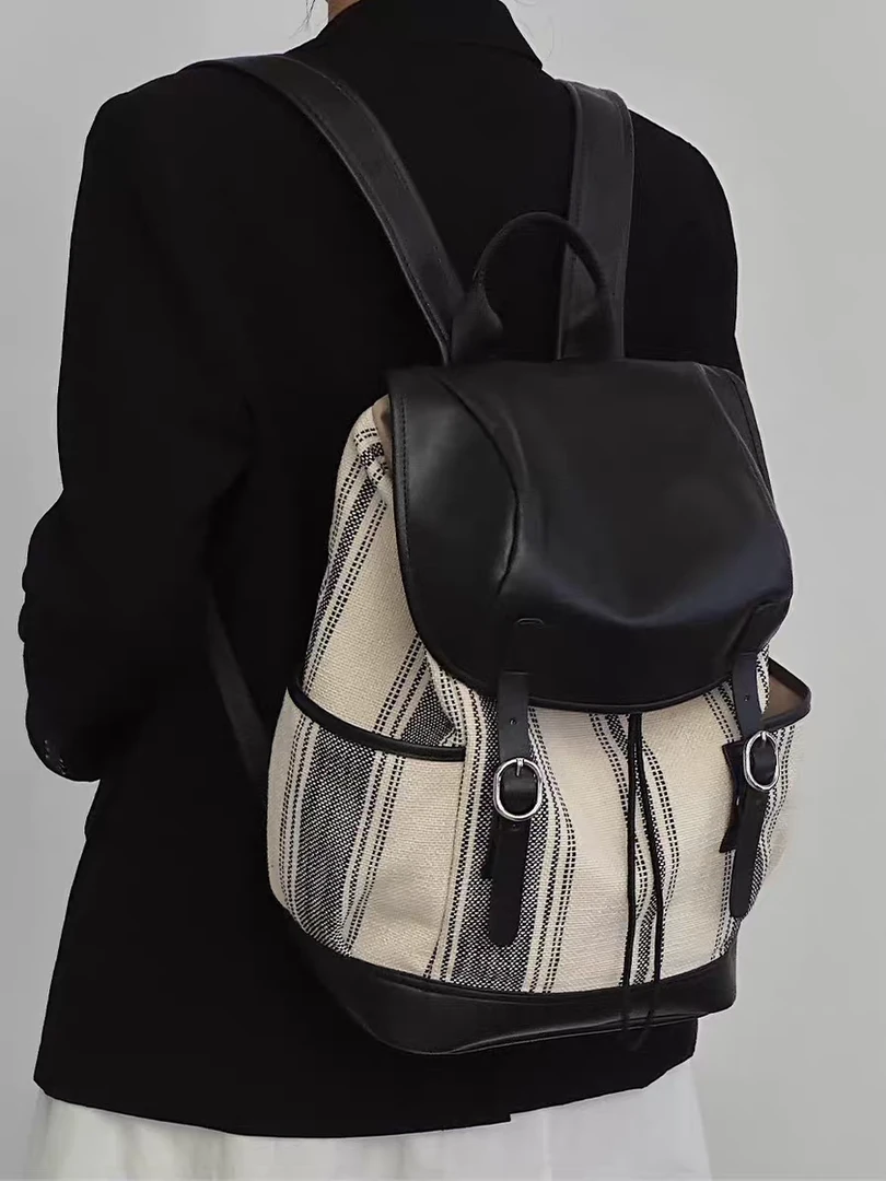 2025新款高级感简约休闲牛皮帆布大容量双肩男女背包手提单肩旅行