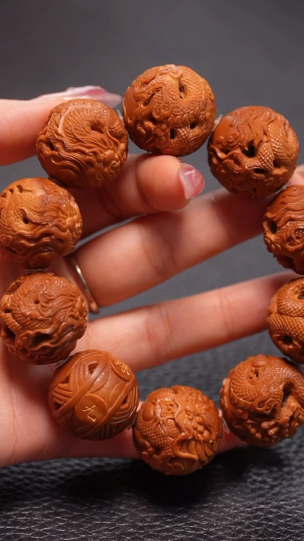 橄榄核手串2.4+正圆九龙戏珠