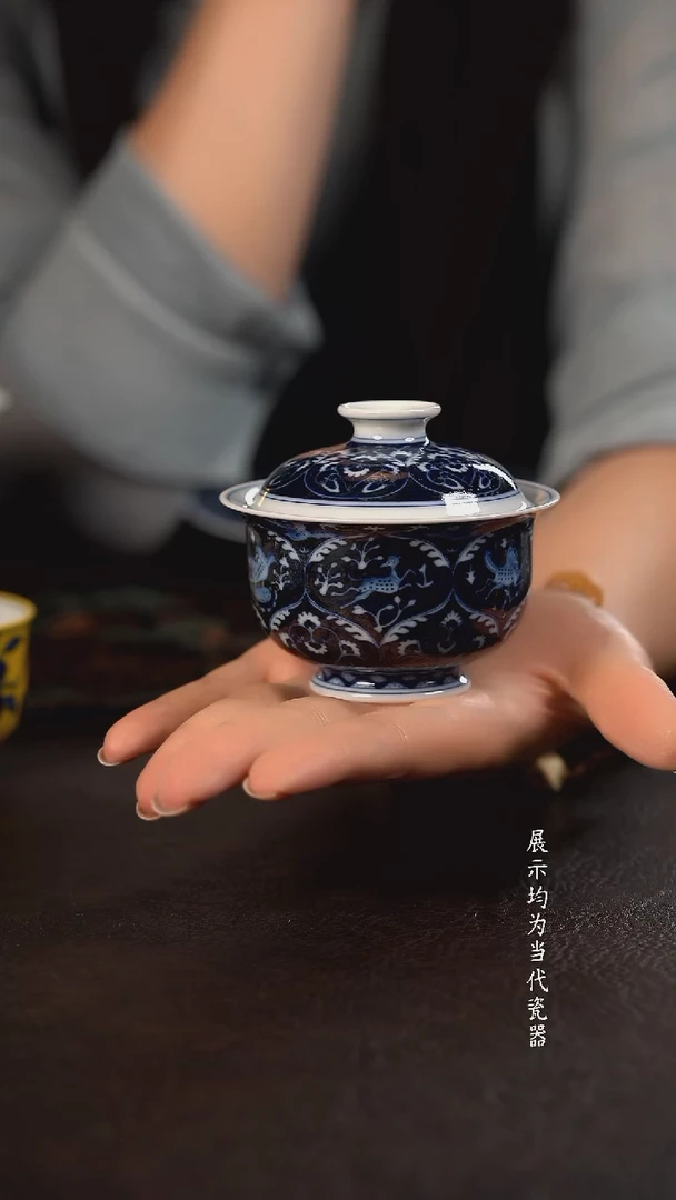 洪印慕明蓝地凤鸟瑞兽布袋盖碗