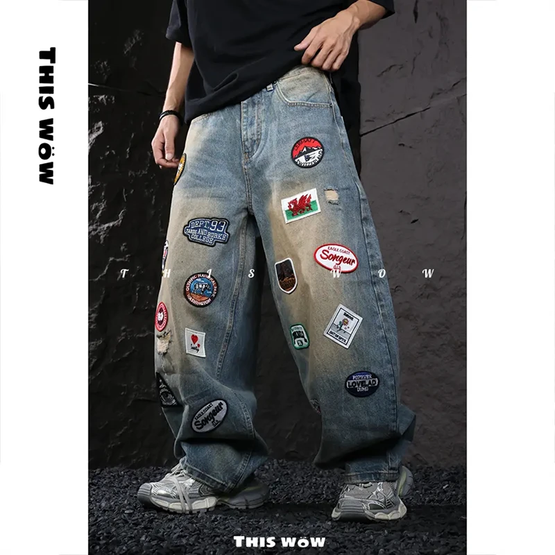 巴黎风潮牌重工贴布绣破洞设计牛仔裤美式宽松个性做旧直筒长裤