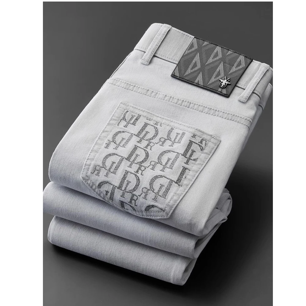 春夏季口袋字母重工艺设计洗水牛仔裤男修身小直筒休闲裤男