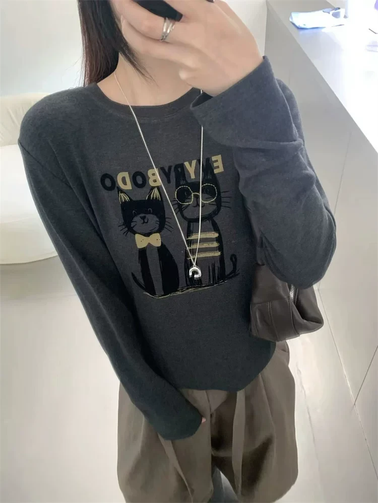 2025秋季新款时尚简约休闲圆领宽松显瘦百搭卡通印花长袖打底上衣