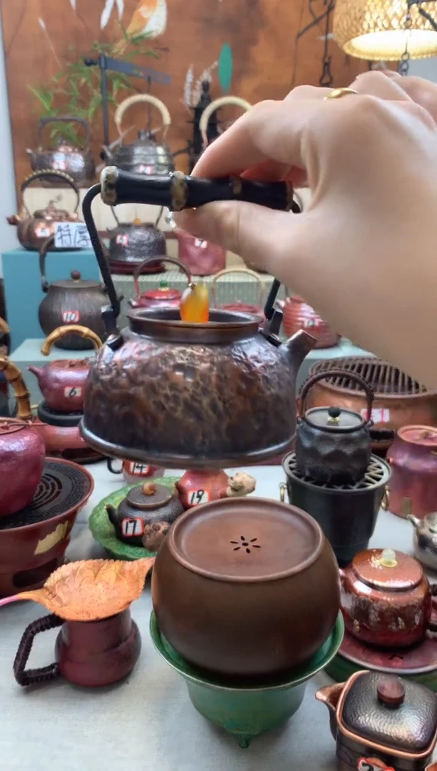 铁*音紫竹提梁黑石头纹壶