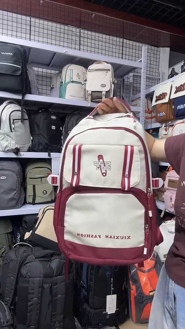 尼龙白配红小学初中女生双肩包