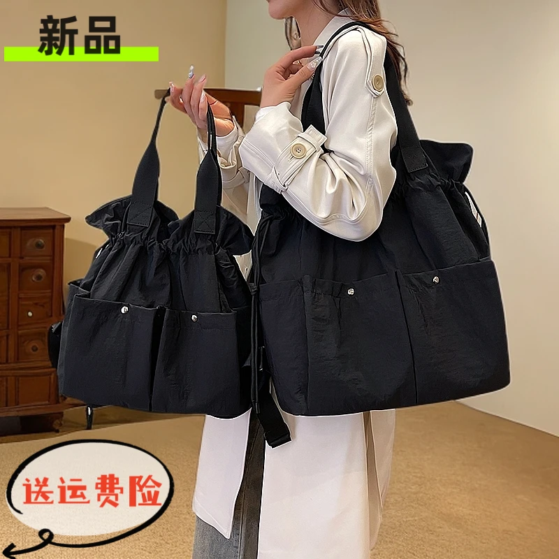 新款大容量通勤旅行双肩包单肩手提包包女轻便牛津布背包多功能布