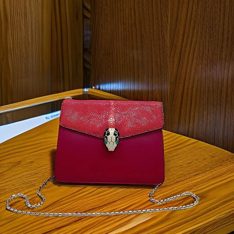 95新 BVLGARI/宝格丽 粉色珍珠鱼皮蛇头包1093 3334