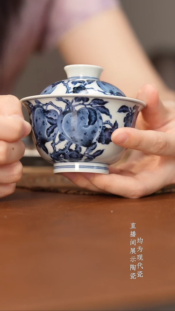 杯志纯窑青花寿桃