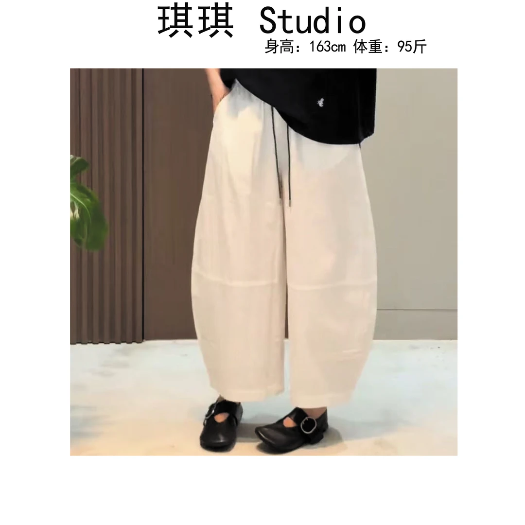 《琪琪家》夏季新款气质时尚松紧腰迷彩抽绳减龄弯刀气球裤2599-CS