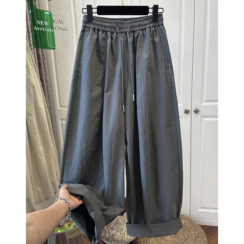 K00064欧洲站灰绿色松紧腰抽绳休闲裤女弯刀裤宽松褶皱气球裤夏款