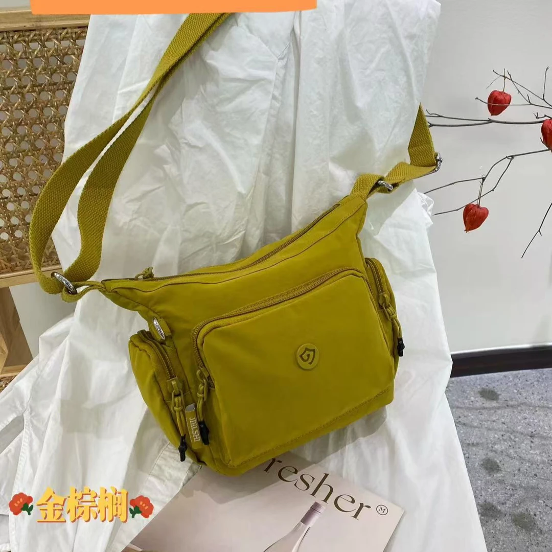 5677春夏新款多口袋便捷相机包单肩斜跨包百搭高品质简约潮流肩包