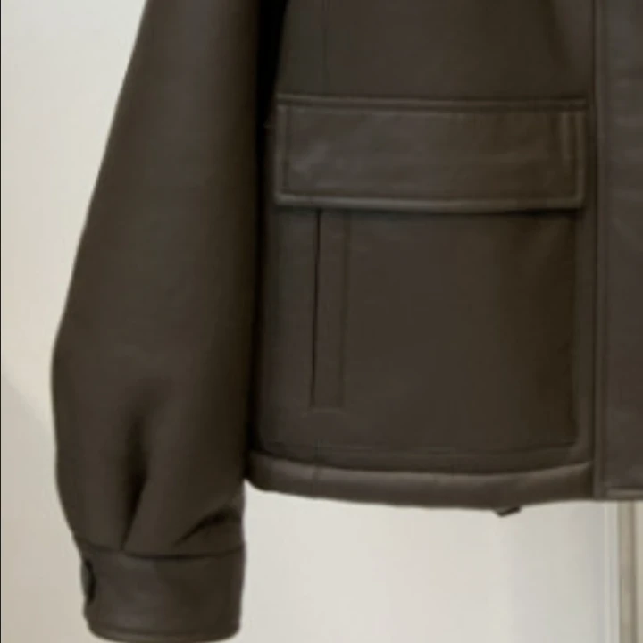 插肩立领双口袋一体皮衣