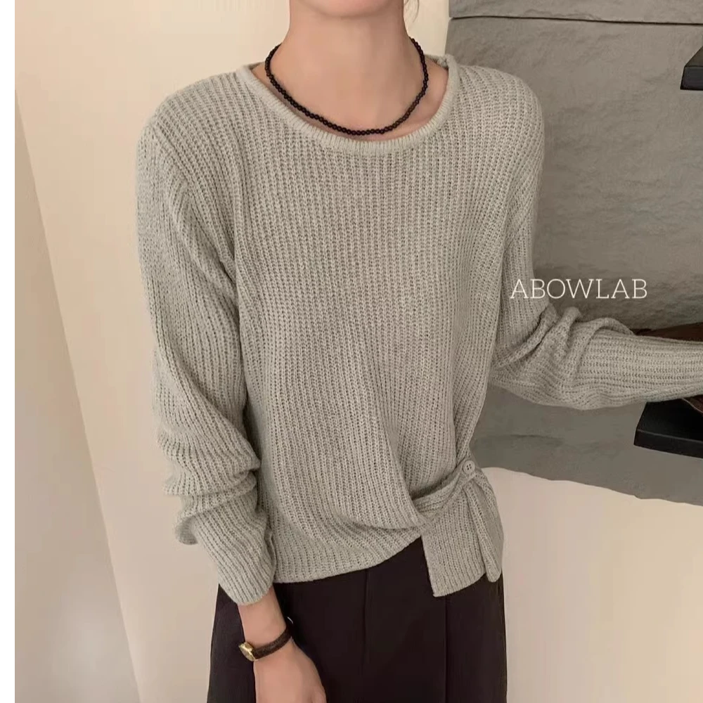 A9021-时尚下摆提扣设计长袖针织衫秋季宽松圆领纯色上衣
