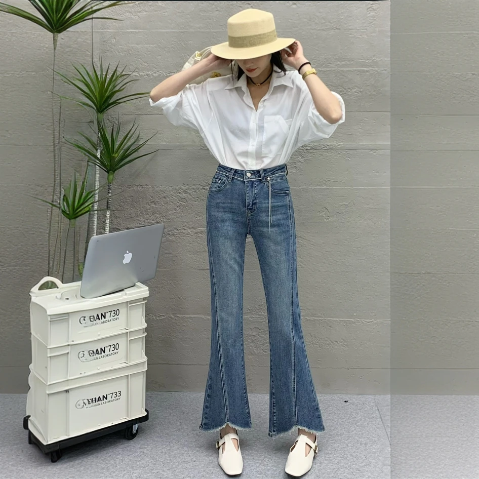 UM设计感复古蓝毛边牛仔裤女辣妹修身高腰微喇马蹄拖地裤