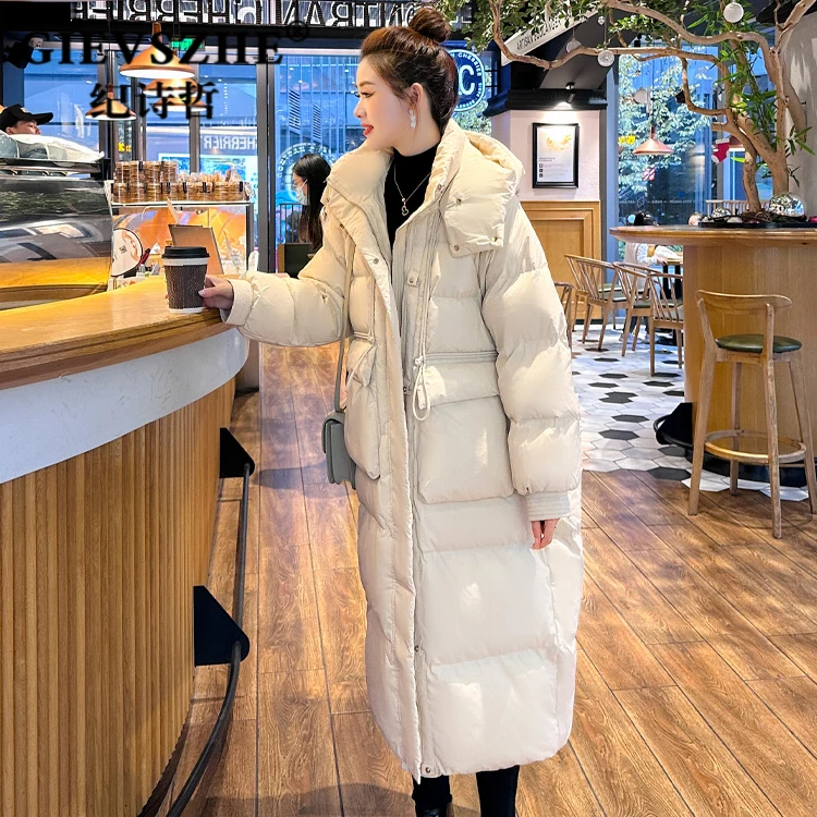 纪诗哲设计感羽绒服女长款过膝2025新款连帽加厚卡其色白鹅绒外套
