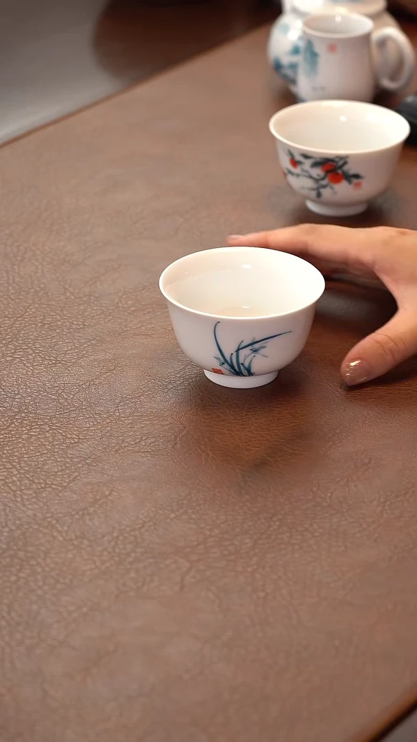 瓷片柴烧白瓷兰花压手杯