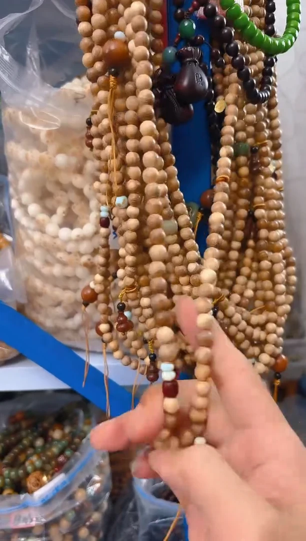 粉压象牙果吊坠斜跨手机链一条