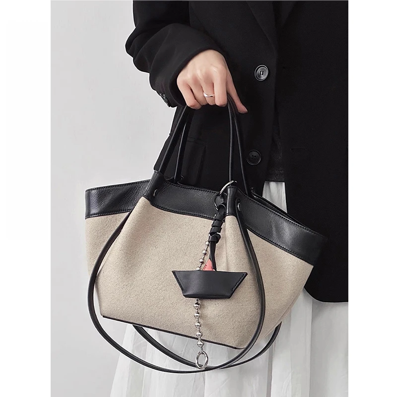 托特包包女式2025新款春季大容量休闲帆布撞色拼接通勤单肩翅膀包