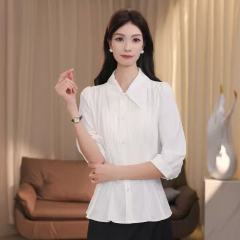 QH80627新款收腰显瘦上衣时尚通勤别致漂亮裙摆上衣