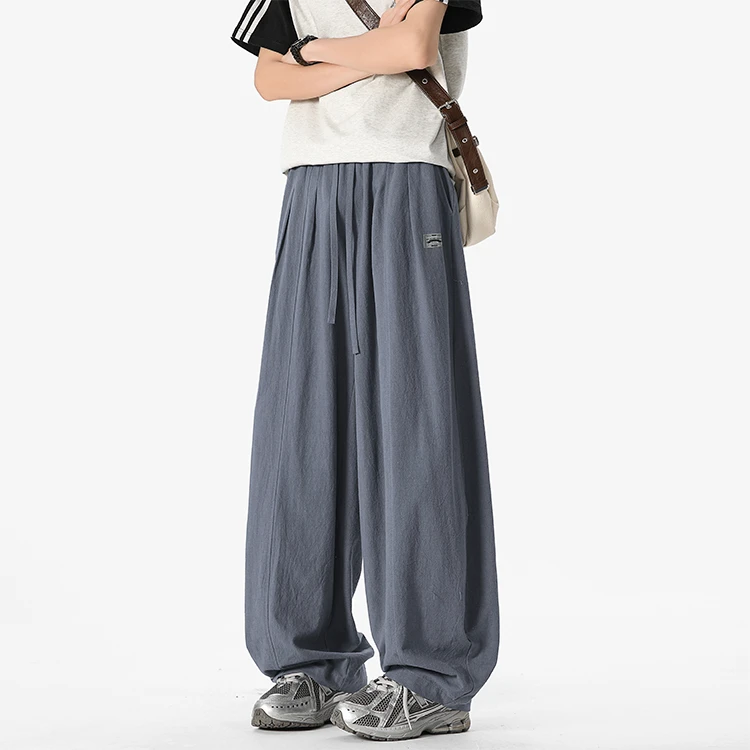 2025年新款夏季薄款棉麻贴标宽松时尚大码复古垂感拖地弯刀裤子男