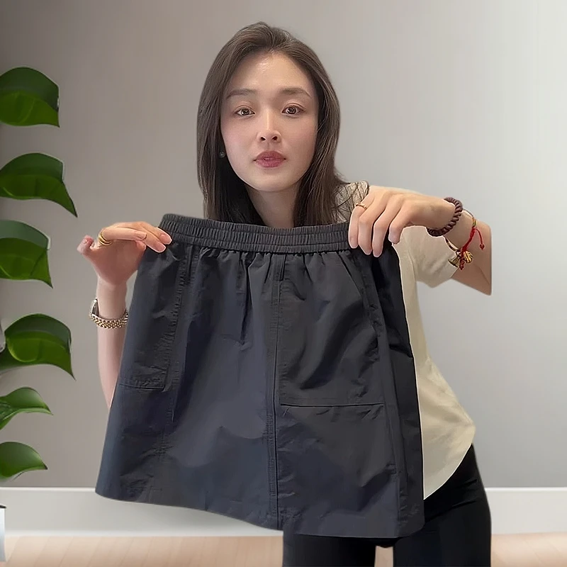 黑色宽松显瘦工装短裙女夏季复古设计感纯色A字裙高腰聚酯纤维