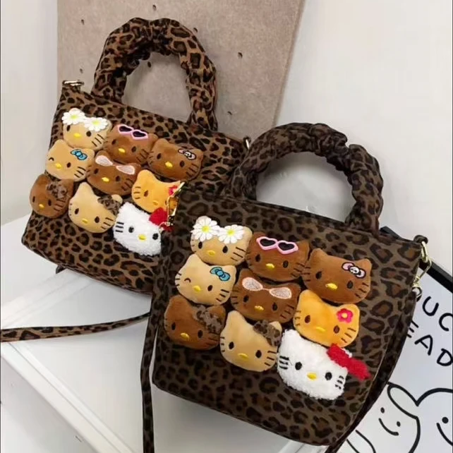 可爱小女孩豹纹水桶包玩偶风手拎单肩斜挎出游百搭包