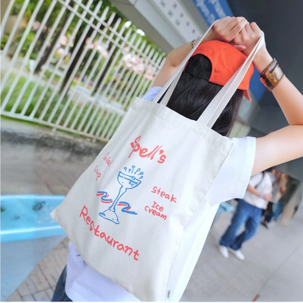 A06 SPELL2025春季新品Spell餐厅帆布包可爱卡通印花手提单肩包