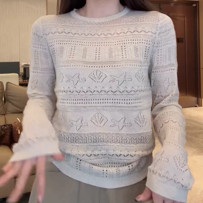 《惬意时光》早秋新款气质轻薄款百搭镂空显瘦开衫LK2505791