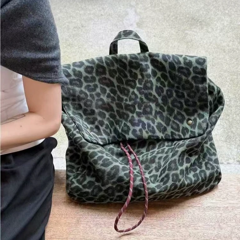 白缇雅时尚个性豹纹帆布包2025新款大容量通勤旅游双肩包背包书包