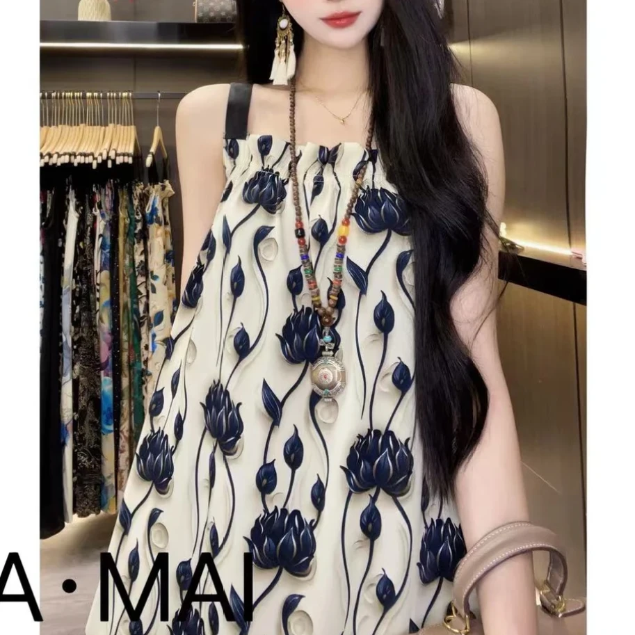 2025夏季新款时尚印花大花朵轻奢宽松遮肉沙滩裙长款吊带连衣裙