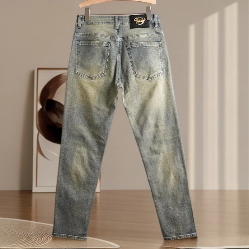 劲莱复古修身牛仔裤黄泥色小脚潮牌怀旧水洗做旧高端男长裤小直筒