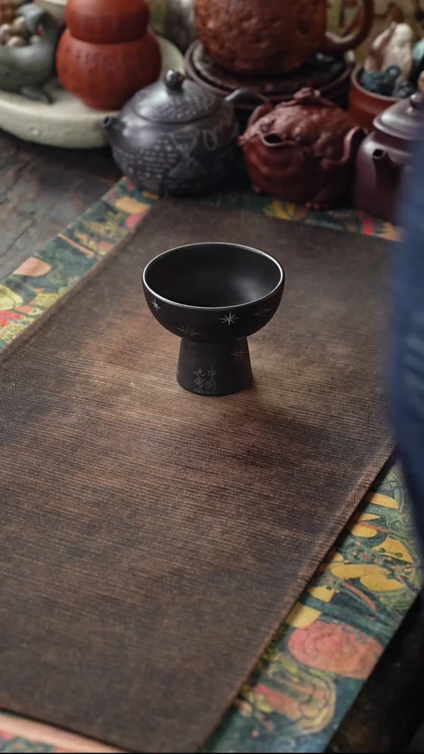 石黄刻绘星星紫砂杯