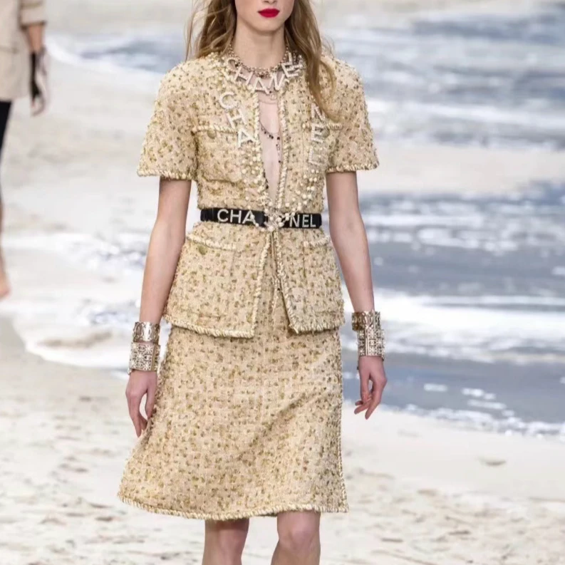 99新 Chanel/香奈儿 沙滩系列34码金色短袖编织开衫+36码半身短裙